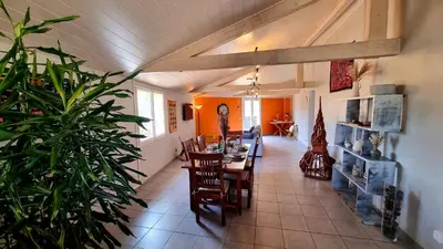 a dining room with a table and chairs at Villa d'Architecte - Cocon Design, Calme & Mer in Fitou