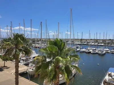 a marina with alot of boats in the water at Au bord de l'eau, Profitez d'un moment de calme ! in Gruissan