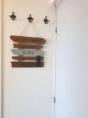 a group of signs hanging on a wall at Au bord de l'eau, Profitez d'un moment de calme ! in Gruissan
