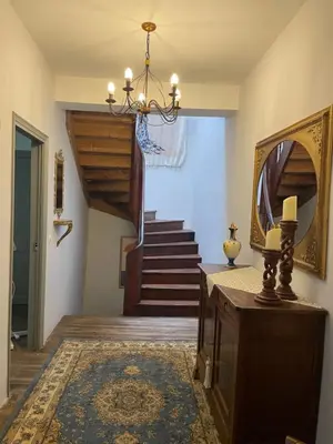 a hallway with a mirror and a staircase at The French House in Quillan in Quillan