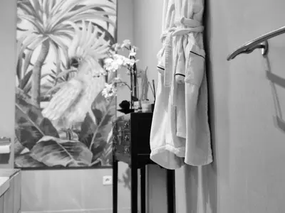 a bathroom with a towel hanging on a wall at Villa Maskali in Cuxac-dʼAude