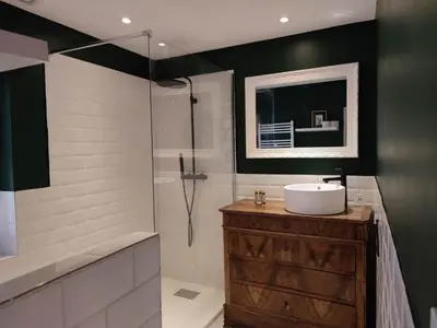 a bathroom with a sink and a shower at La Terrasse du Temps Jadis in Carcassonne